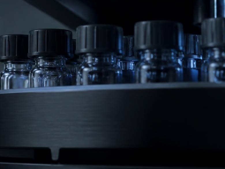 Capped amber-free glass sample vials in the autosampler carousel